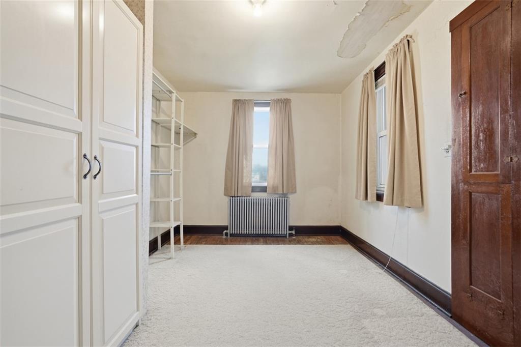 205 Clover Street Pittsburgh, PA 15210 - Photo 21 of 49 an empty room with windows