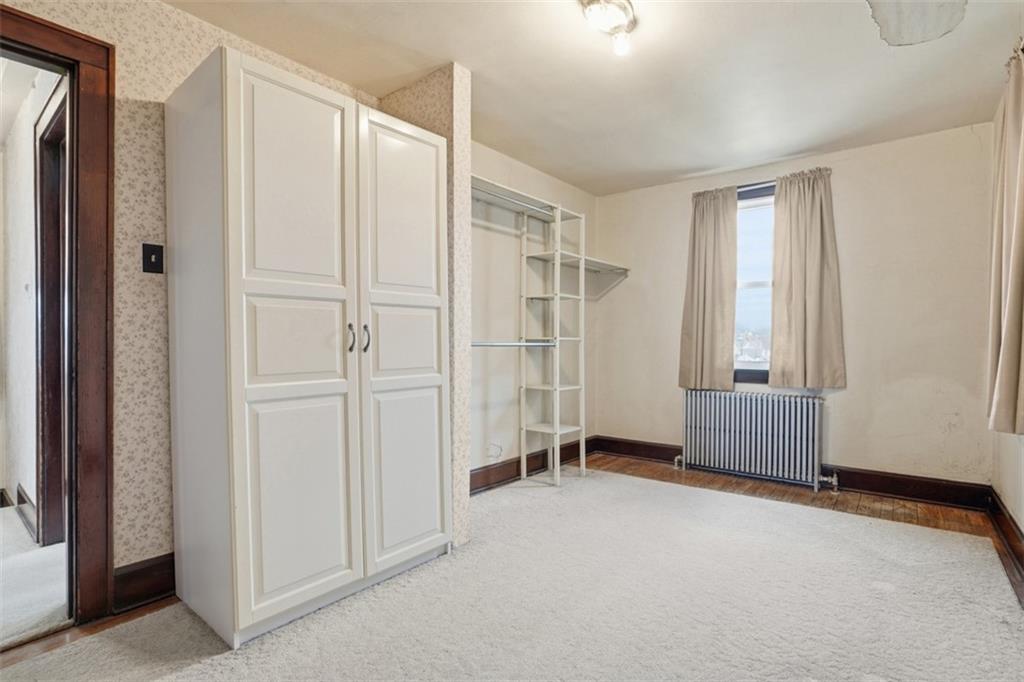 205 Clover Street Pittsburgh, PA 15210 - Photo 22 of 49 a big room with windows and closet