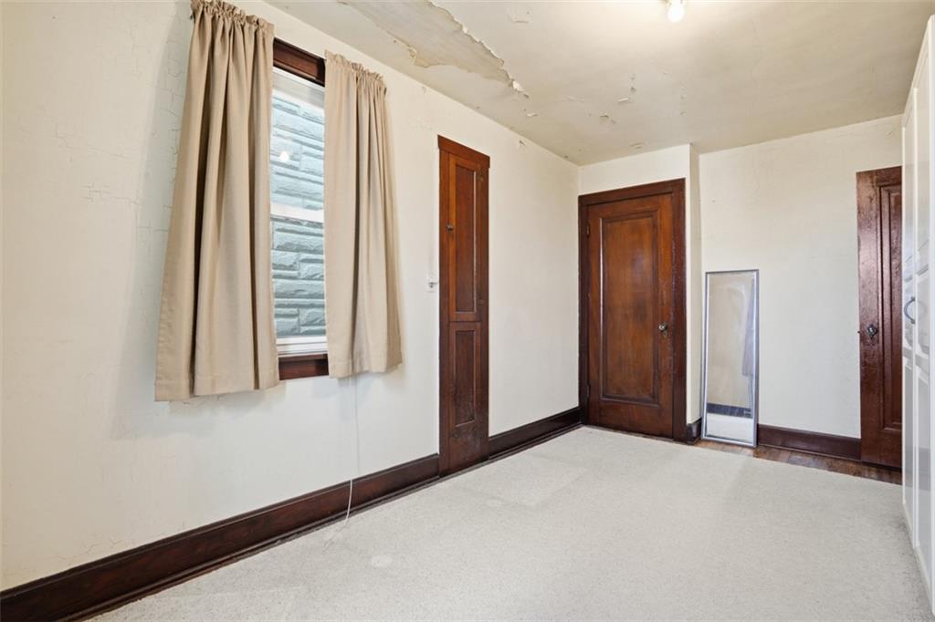 205 Clover Street Pittsburgh, PA 15210 - Photo 23 of 49 an empty room with windows