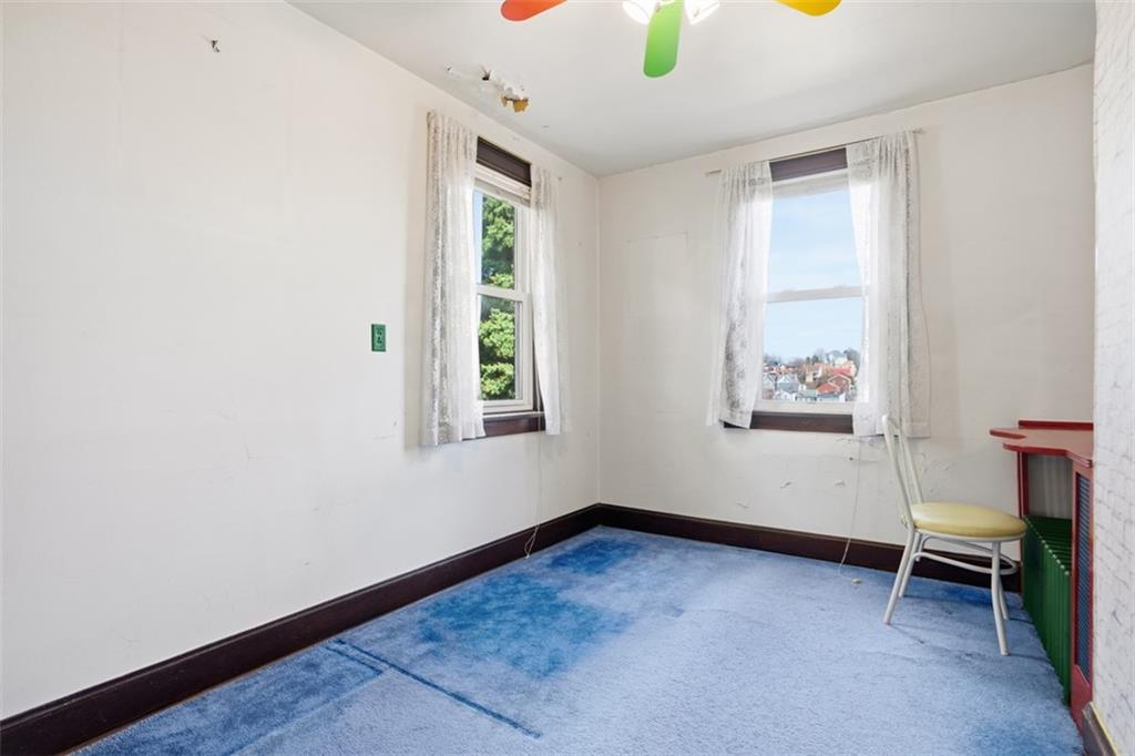 205 Clover Street Pittsburgh, PA 15210 - Photo 24 of 49 an empty room with windows
