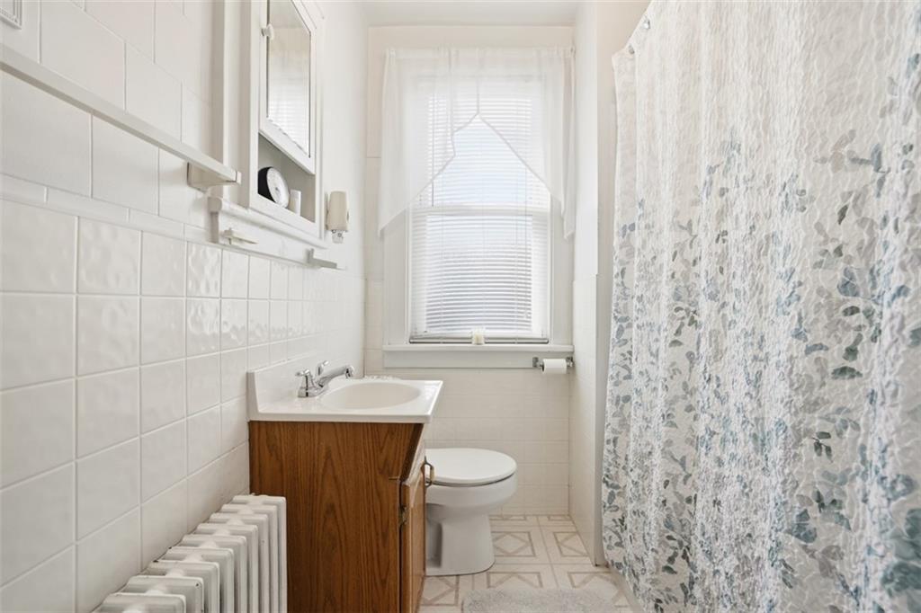 205 Clover Street Pittsburgh, PA 15210 - Photo 27 of 49 a bathroom with a sink a toilet and shower