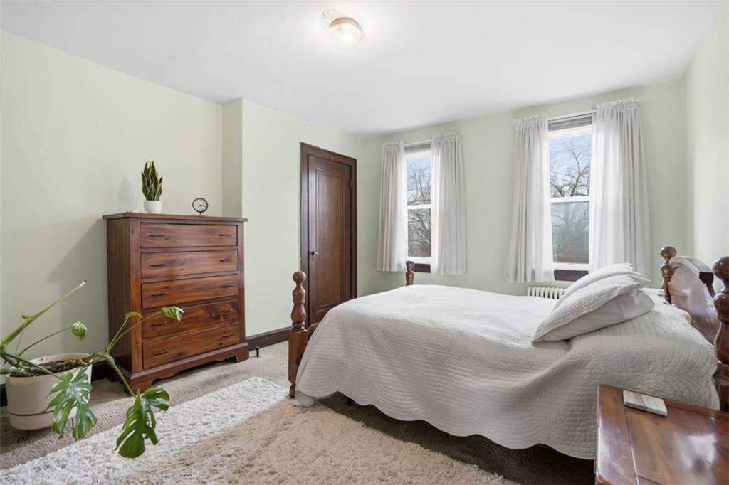 205 Clover Street Pittsburgh, PA 15210 - Photo 28 of 49 a bedroom with a bed and a closet
