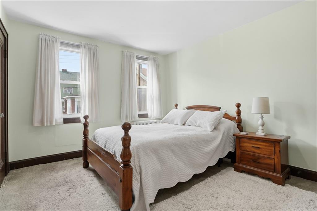 205 Clover Street Pittsburgh, PA 15210 - Photo 29 of 49 a bedroom with a bed and a window