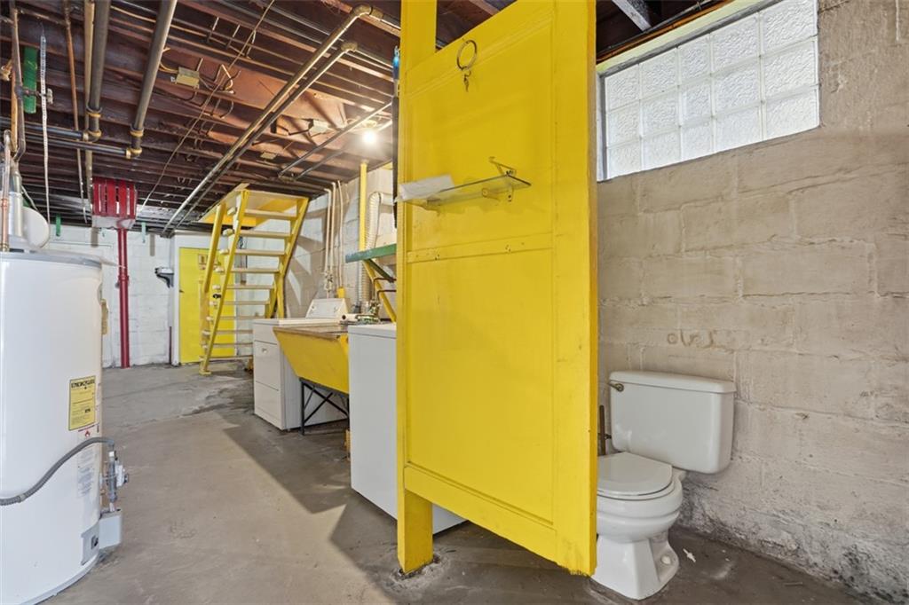 205 Clover Street Pittsburgh, PA 15210 - Photo 32 of 49 a view of a bathroom with a sink and a toilet