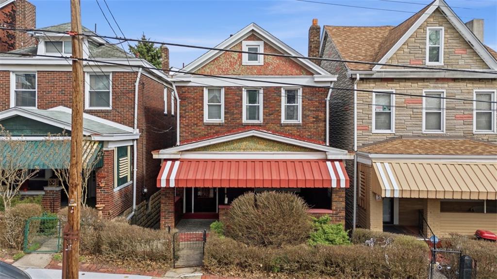 205 Clover Street Pittsburgh, PA 15210 - Photo 40 of 49 a front view of a house with a garden