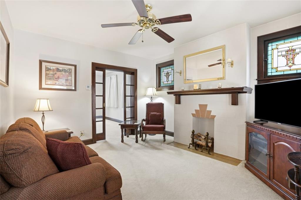 205 Clover Street Pittsburgh, PA 15210 - Photo 6 of 49 a living room with furniture and a flat screen tv