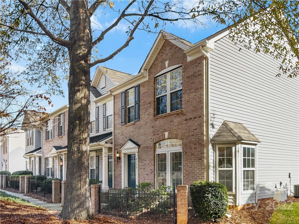 6156 Prosperity Church Road Charlotte, NC 28269 - Photo 1 of 31 a view of a building next to a street