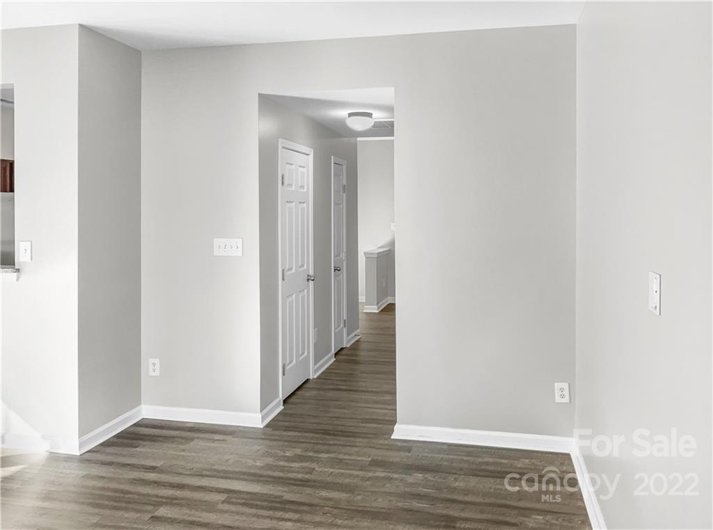 6156 Prosperity Church Road Charlotte, NC 28269 - Photo 13 of 31 a view of a hallway with wooden floor