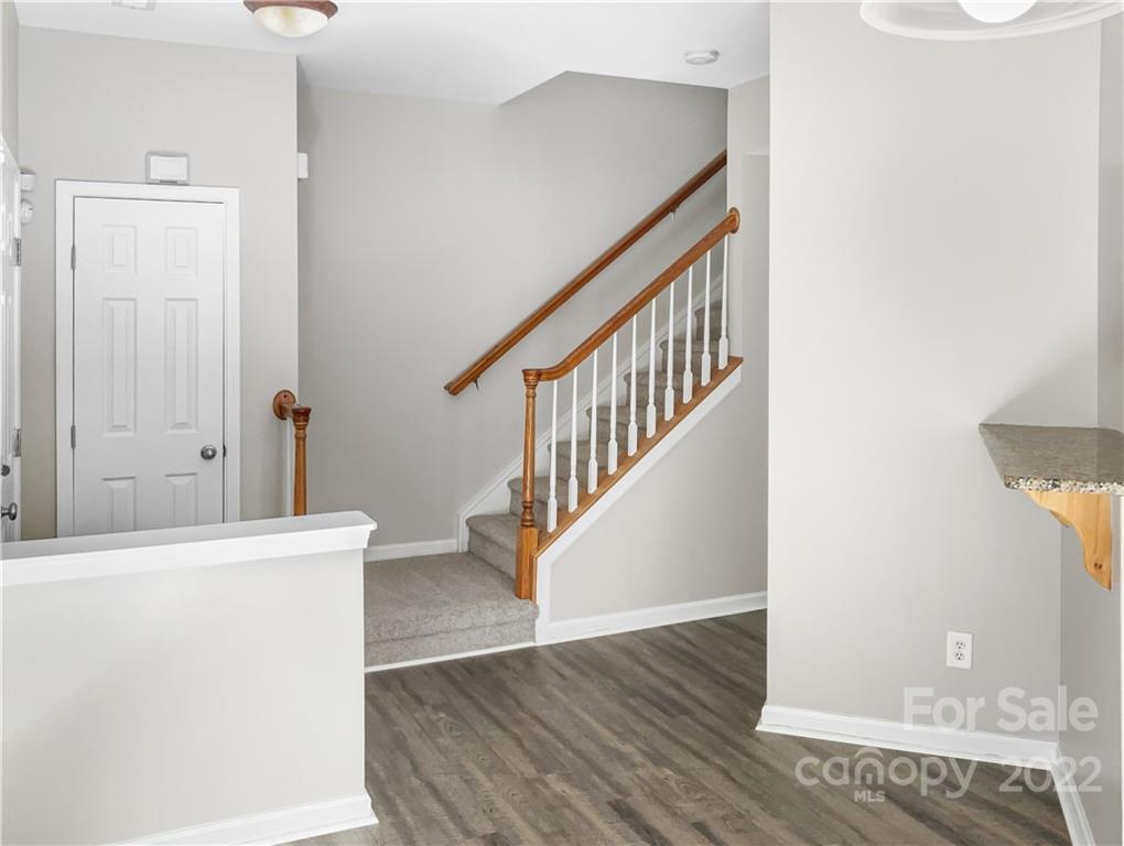 6156 Prosperity Church Road Charlotte, NC 28269 - Photo 19 of 31 a view of a hallway with staircase