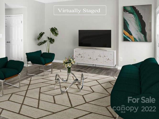 6156 Prosperity Church Road Charlotte, NC 28269 - Photo 2 of 31 a living room with furniture and a flat screen tv