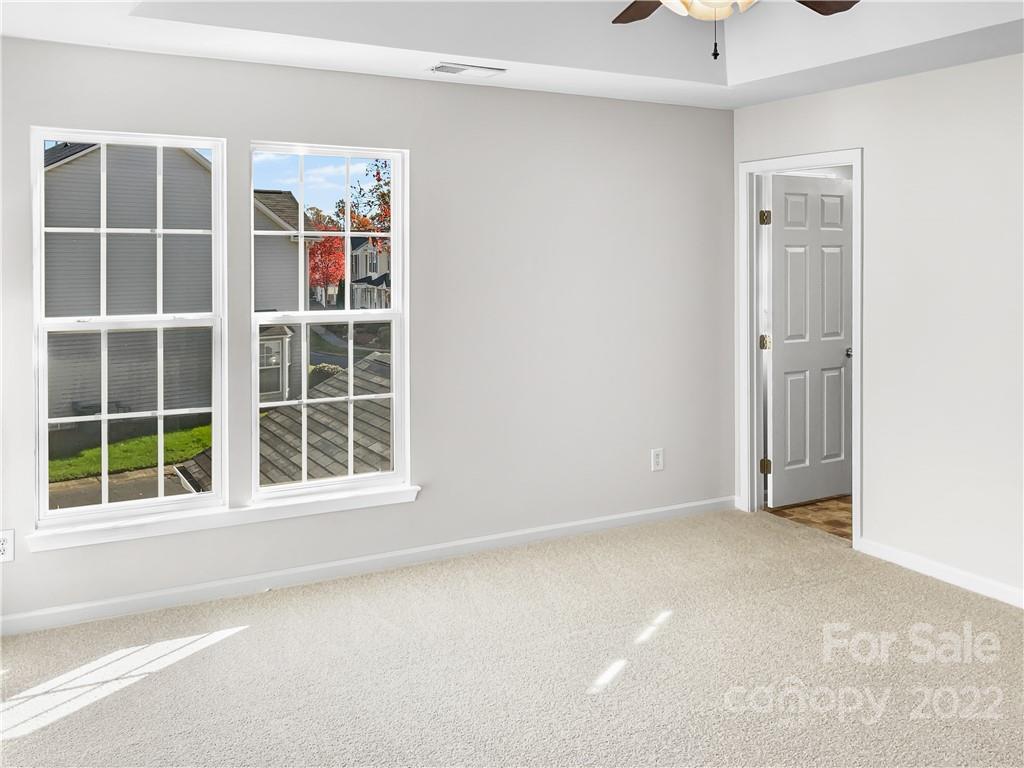 6156 Prosperity Church Road Charlotte, NC 28269 - Photo 22 of 31 an empty room with windows and closet