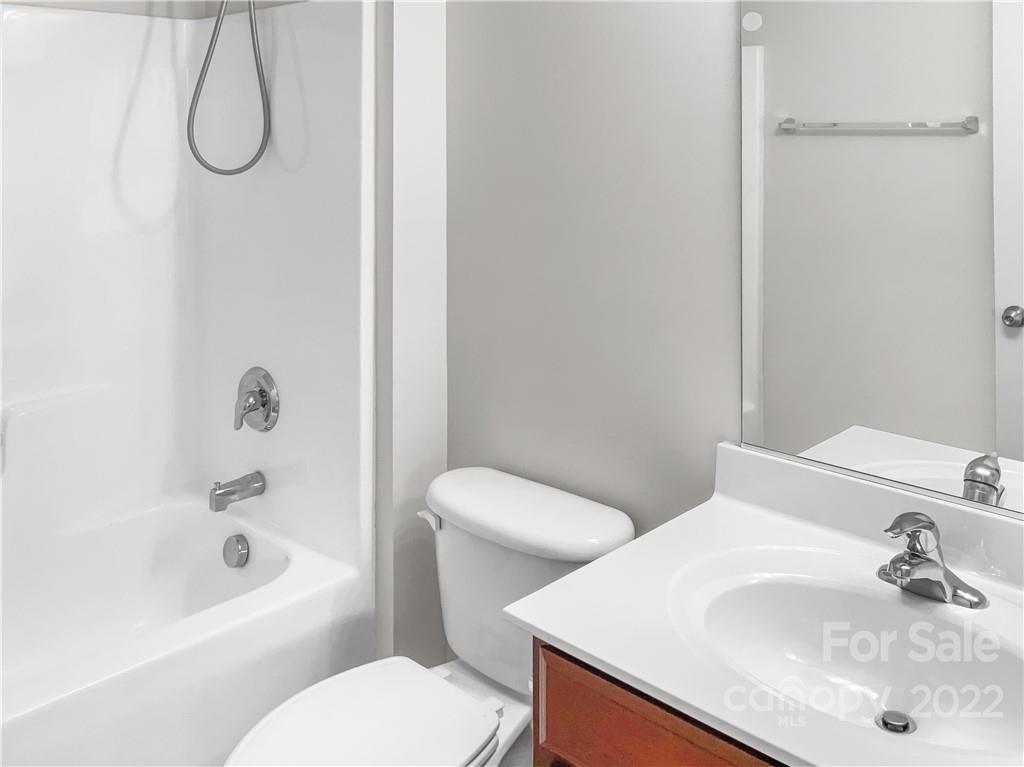 6156 Prosperity Church Road Charlotte, NC 28269 - Photo 30 of 31 a bathroom with a sink toilet and shower