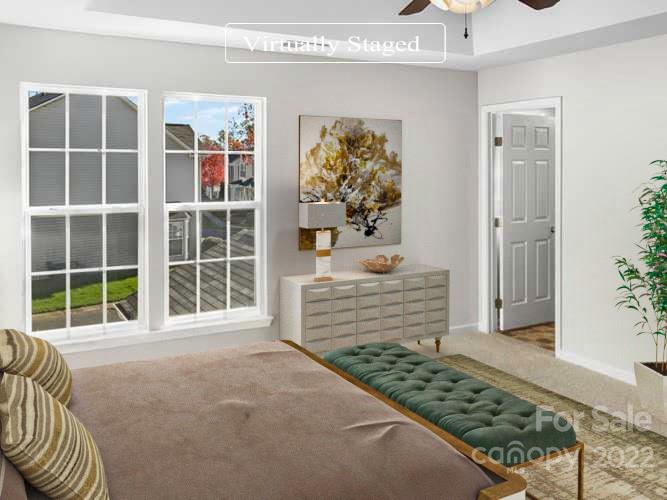 6156 Prosperity Church Road Charlotte, NC 28269 - Photo 3 of 31 a front view of a house with a large window