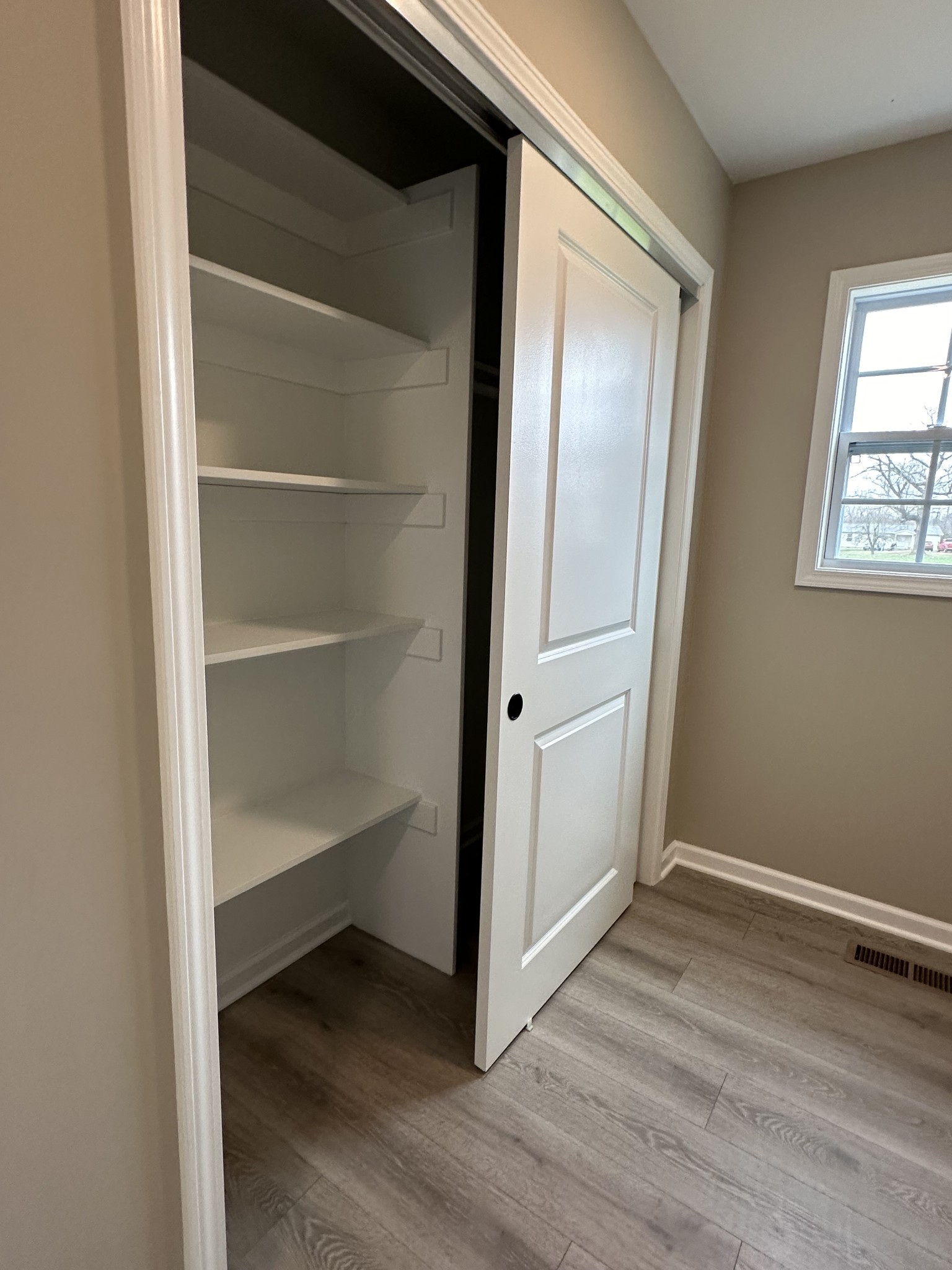 185 Rigling Road Loretto, TN 38469 - Photo 14 of 24 a view of an empty room with closet and a window