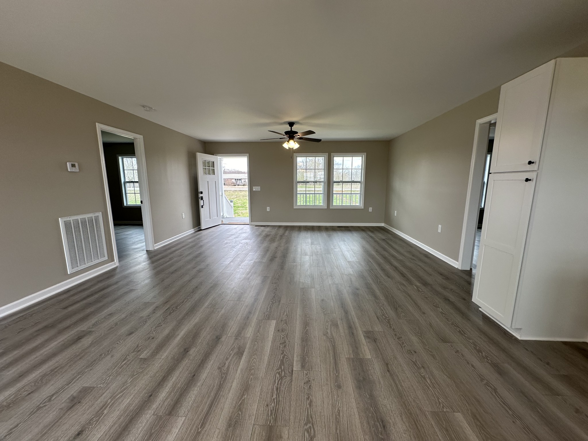 185 Rigling Road Loretto, TN 38469 - Photo 15 of 24 an empty room with wooden floor and windows