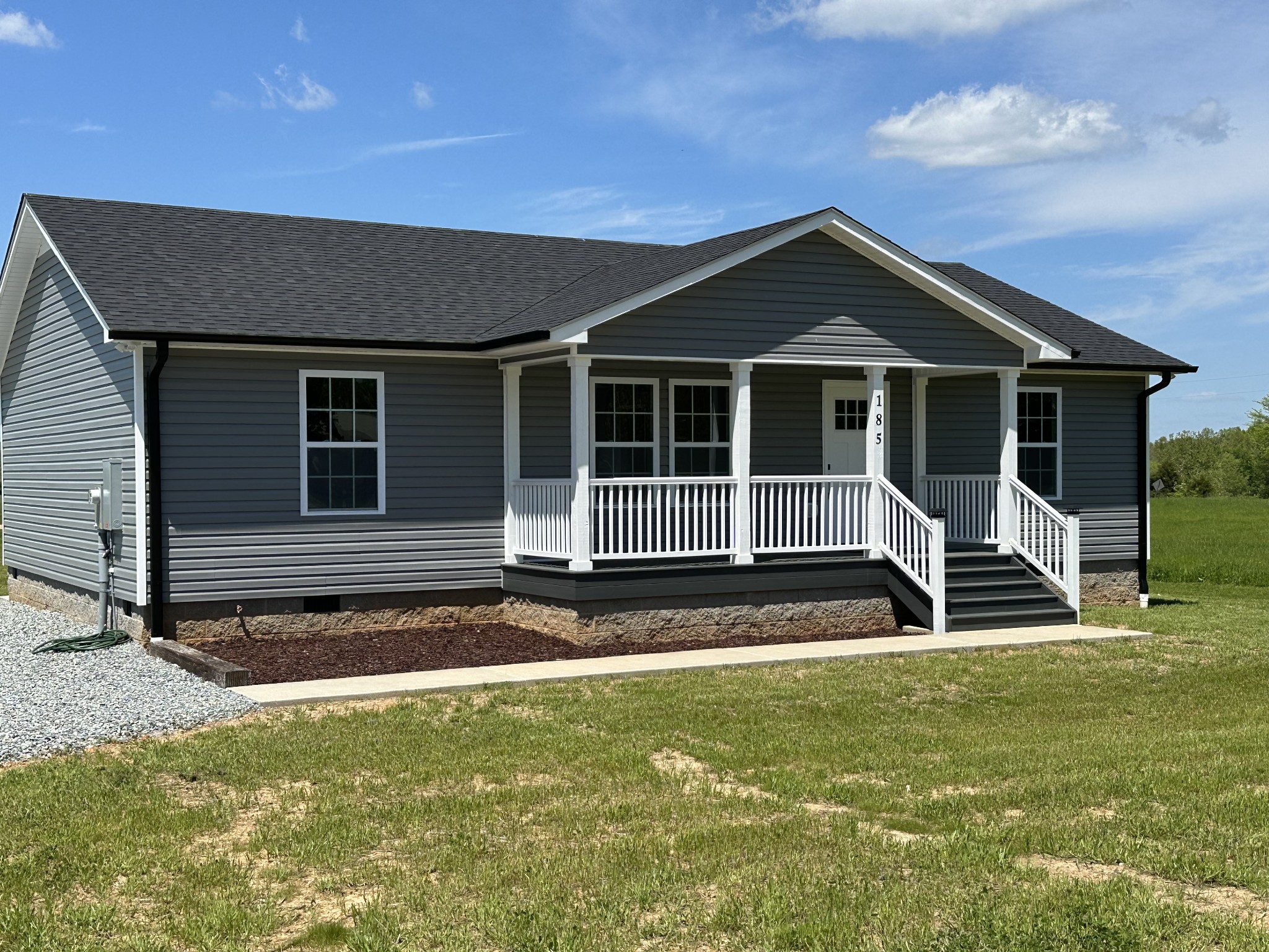 185 Rigling Road Loretto, TN 38469 - Photo 2 of 24 a house with trees in the background