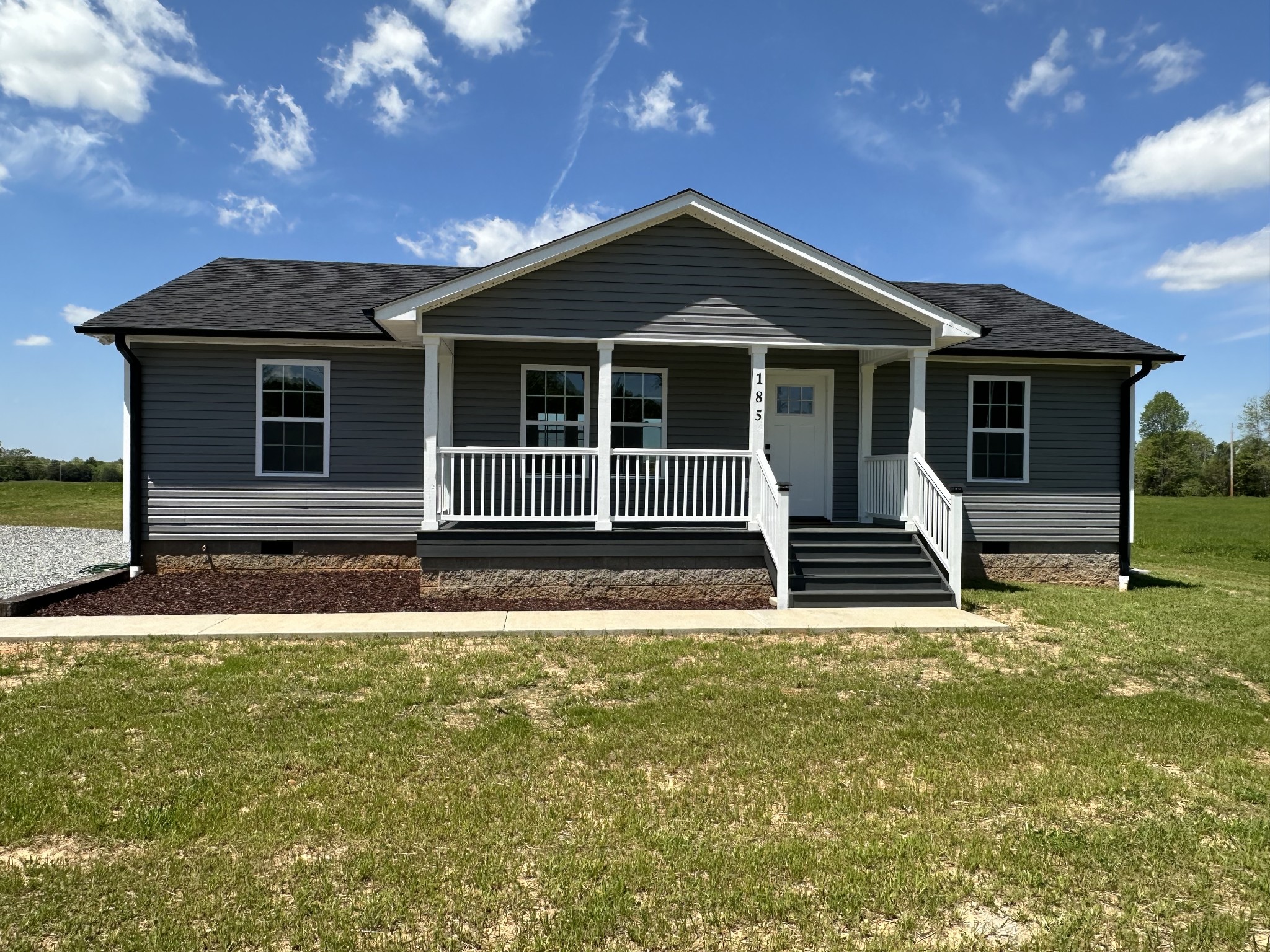 185 Rigling Road Loretto, TN 38469 - Photo 3 of 24 a front view of a house with garage