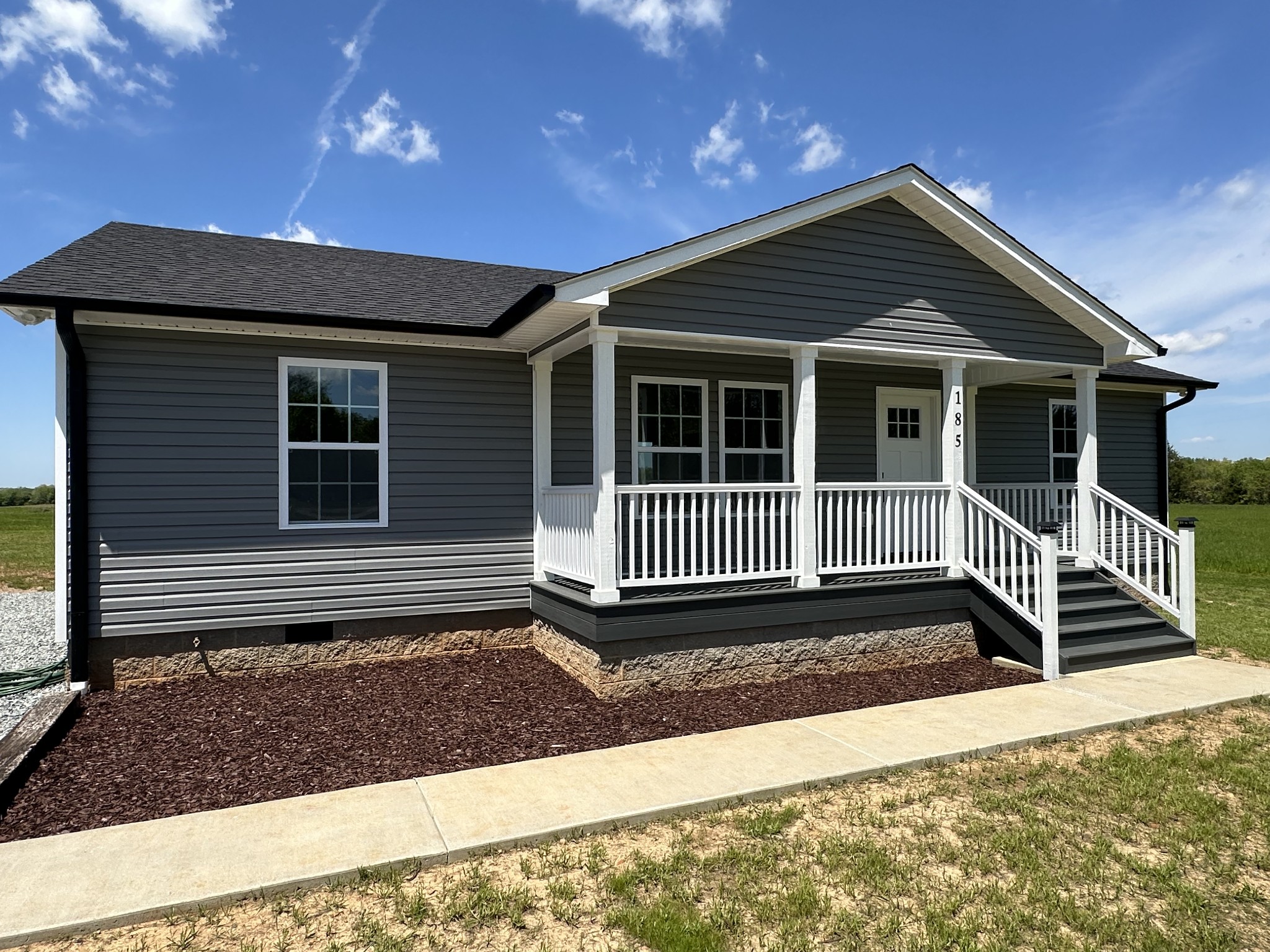 185 Rigling Road Loretto, TN 38469 - Photo 4 of 24 a front view of a house with a fence