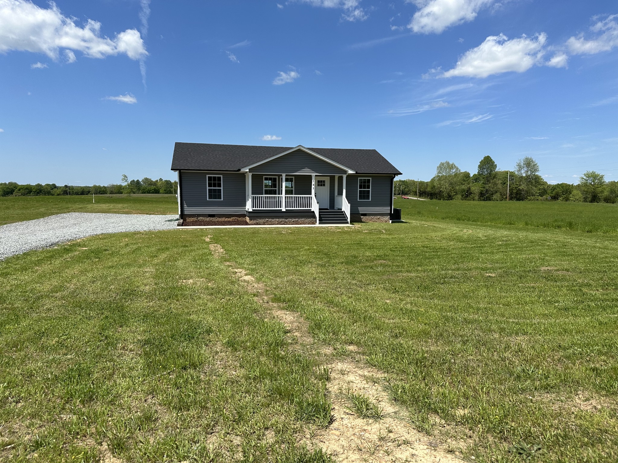 185 Rigling Road Loretto, TN 38469 - Photo 7 of 24 a front view of a house with a yard