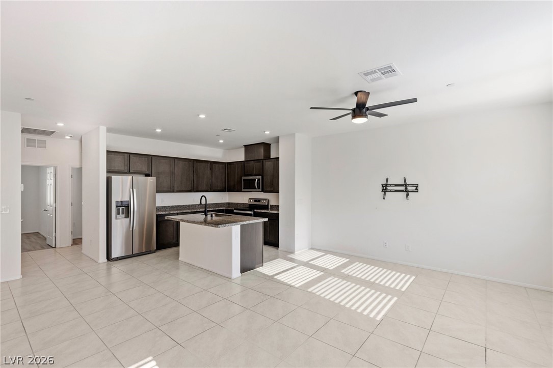 6227 Runestone Street Las Vegas, NV 89113 - Photo 18 of 33 This bright and airy kitchen with an island provides the perfect gathering space.