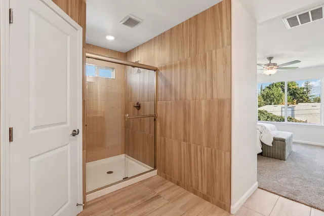 a bathroom with a shower and a tub