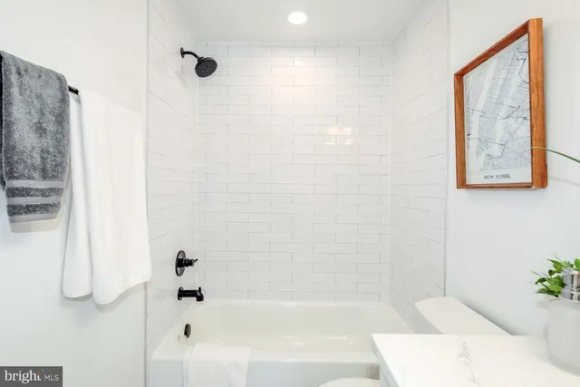 a bathroom with a bathtub and shower