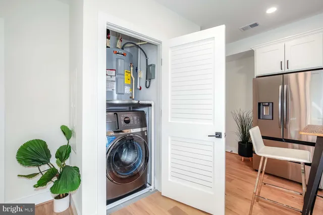a view of hallway with washer and dryer