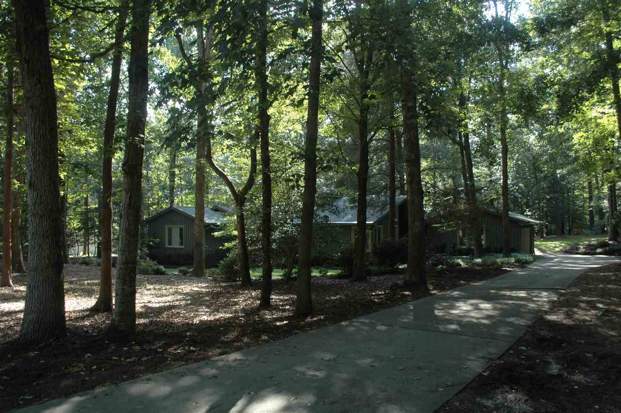 2012 Countrywood Road North Raleigh, NC 27615 - Photo 15 of 18 Long driveway leading to house nestled in woods. Exterior Front