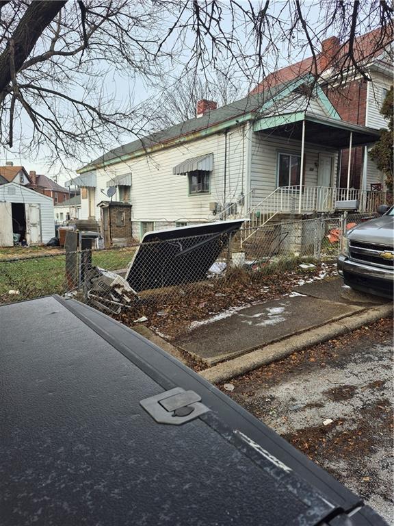 822 Lamont Street McKees Rocks, PA 15136 - Photo 1 of 1 a front view of a house with garden