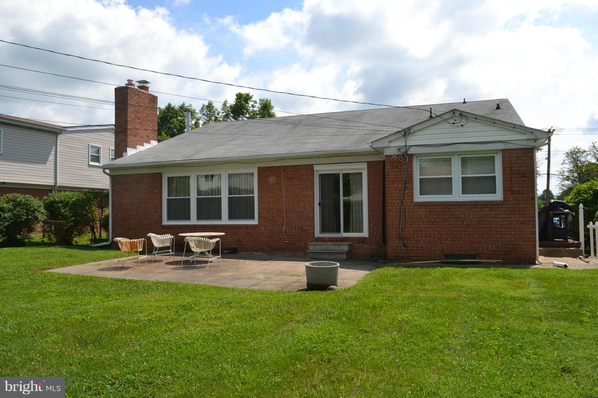 6602 Pimlico Road Baltimore, MD 21209 - Photo 3 of 23 a front view of house with yard and seating area