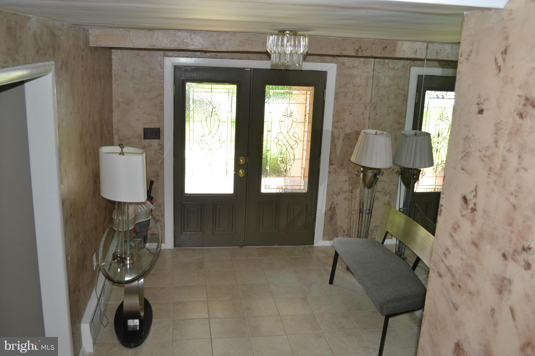 6602 Pimlico Road Baltimore, MD 21209 - Photo 5 of 23 a bathroom with a toilet and a mirror