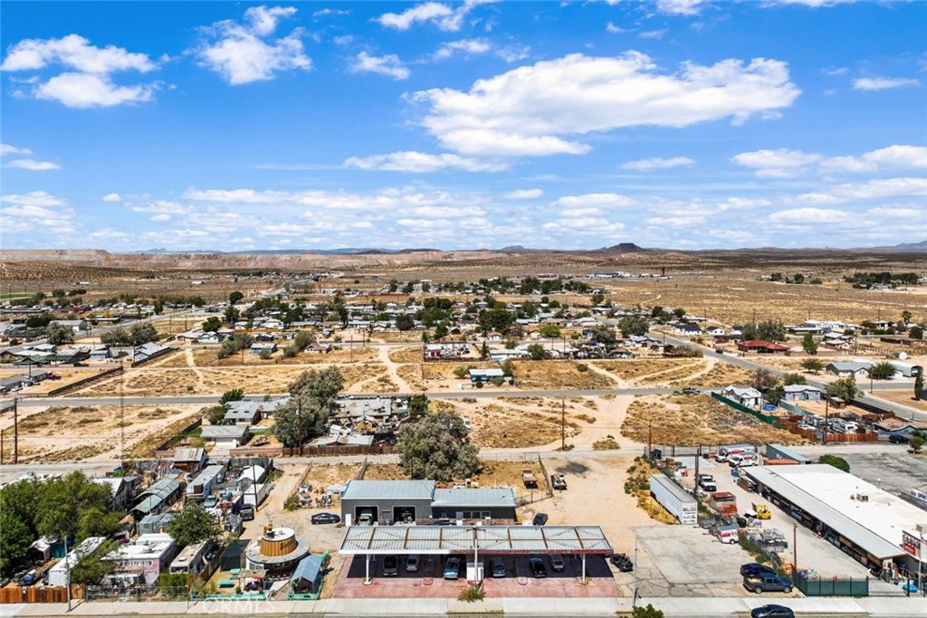 27157 Twenty Mule Team Road Boron, CA 93516 - Photo 27 of 32 an aerial view of residential building with parking
