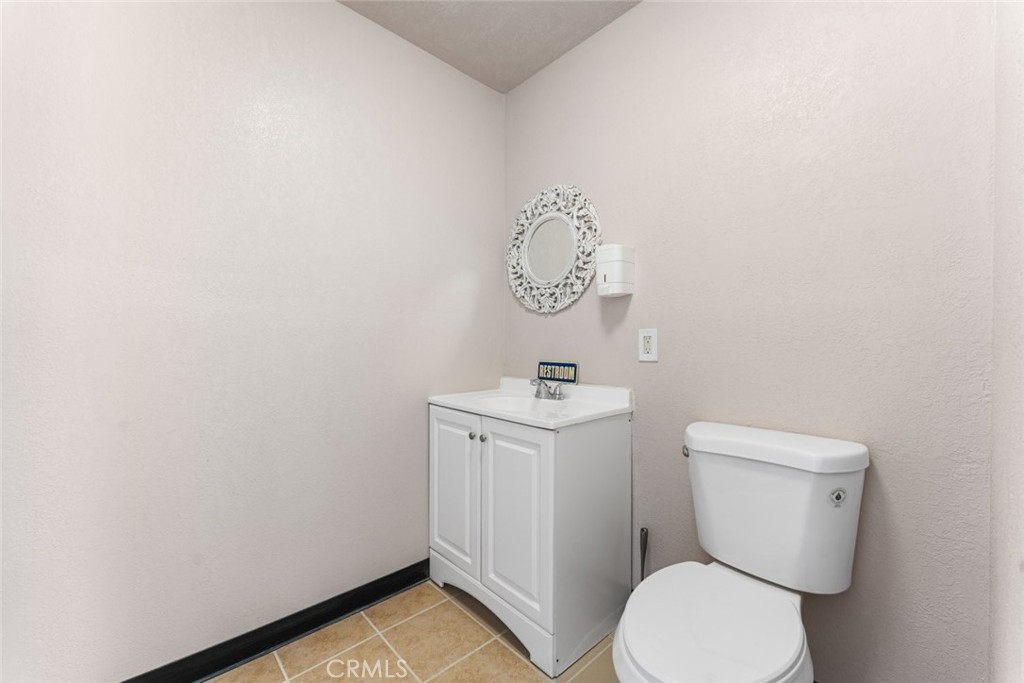 27157 Twenty Mule Team Road Boron, CA 93516 - Photo 8 of 32 a bathroom with a toilet and a sink