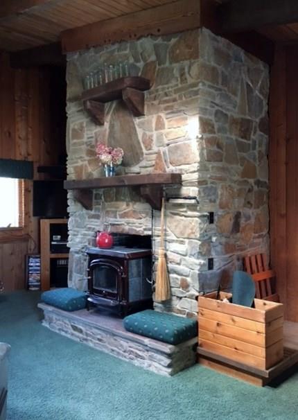 Living Room w/floor to ceiling stone fireplace