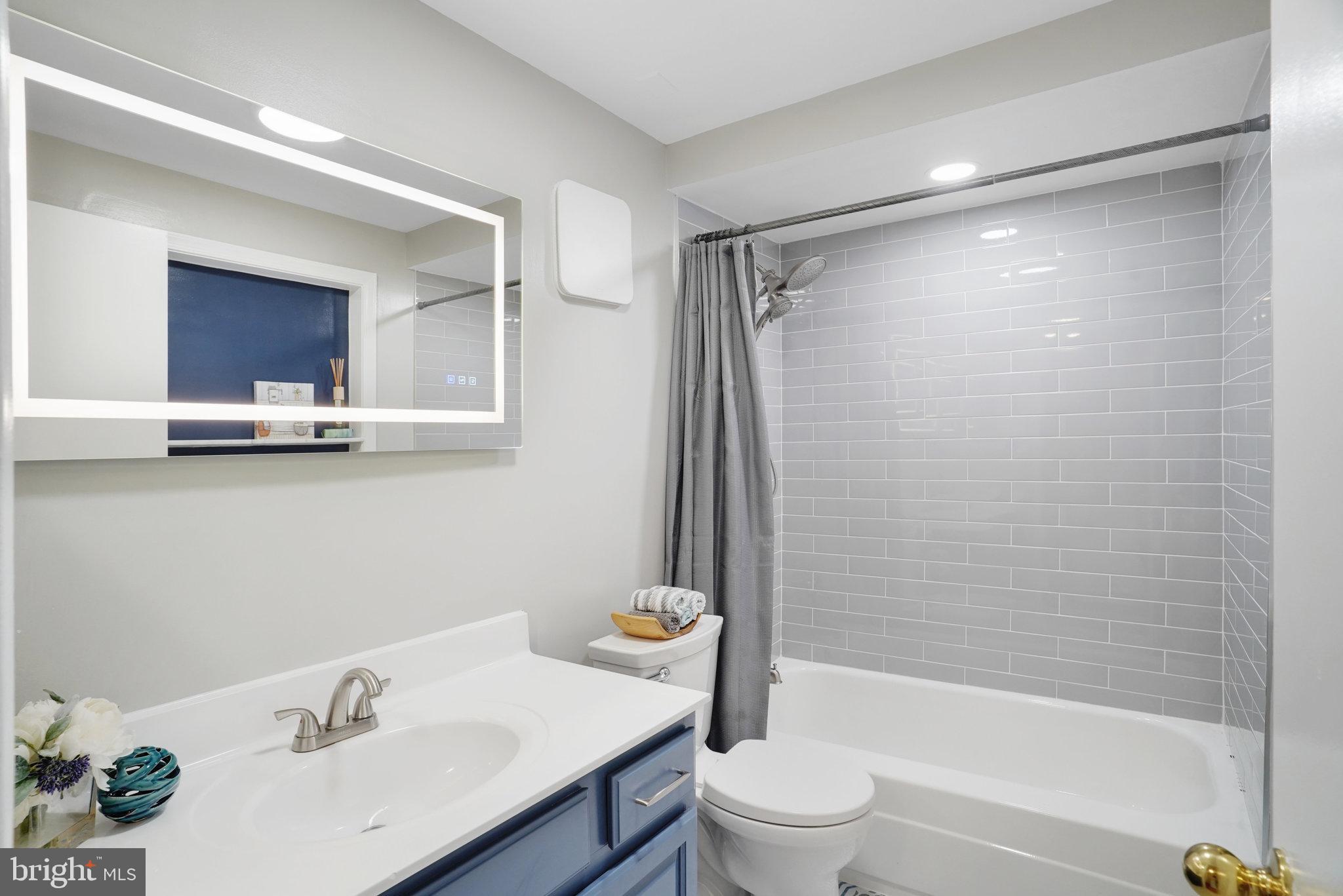 5925 Minutemen Road, Unit 248 Springfield, VA 22152 - Photo 21 of 26 Updated full bath w/ tasteful tiles and LED mirr