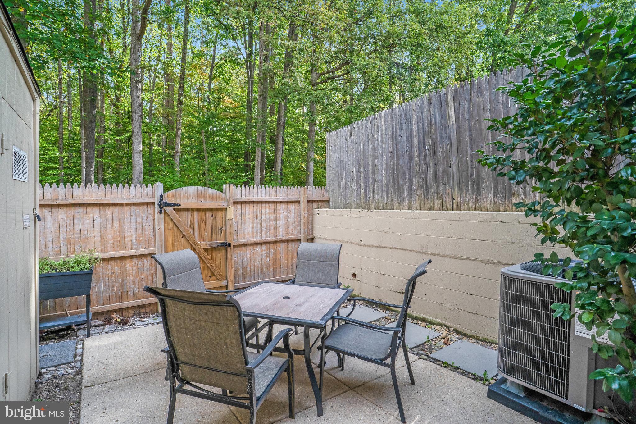 5925 Minutemen Road, Unit 248 Springfield, VA 22152 - Photo 25 of 26 Low maintainence patio with serene wooded backyard