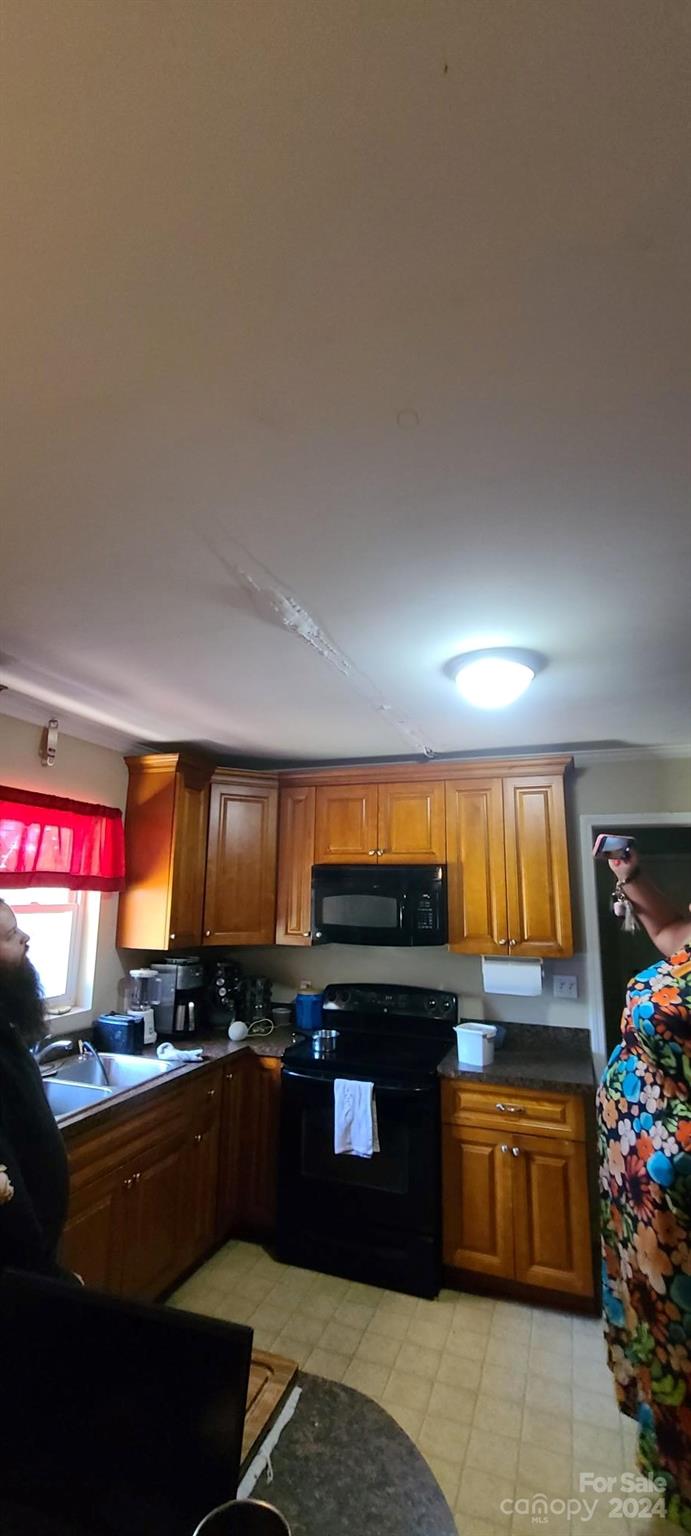 2210 Goldmine Road Monroe, NC 28110 - Photo 8 of 14 a kitchen with stainless steel appliances kitchen island granite countertop a refrigerator stove and sink