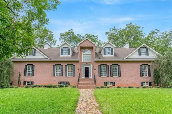 front view of a house with a yard