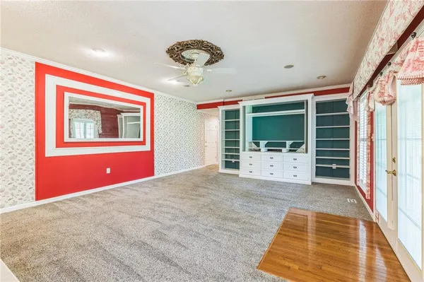 a kitchen with cabinets a sink and appliances