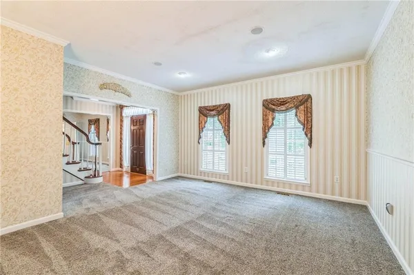 a view of an empty room with a window