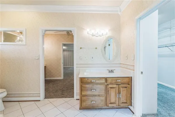 a view of a kitchen with a chandelier and ceiling fan
