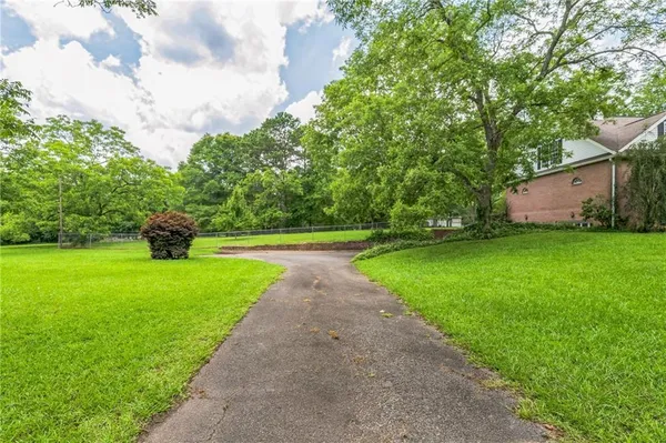 a view of a yard with porch and garden