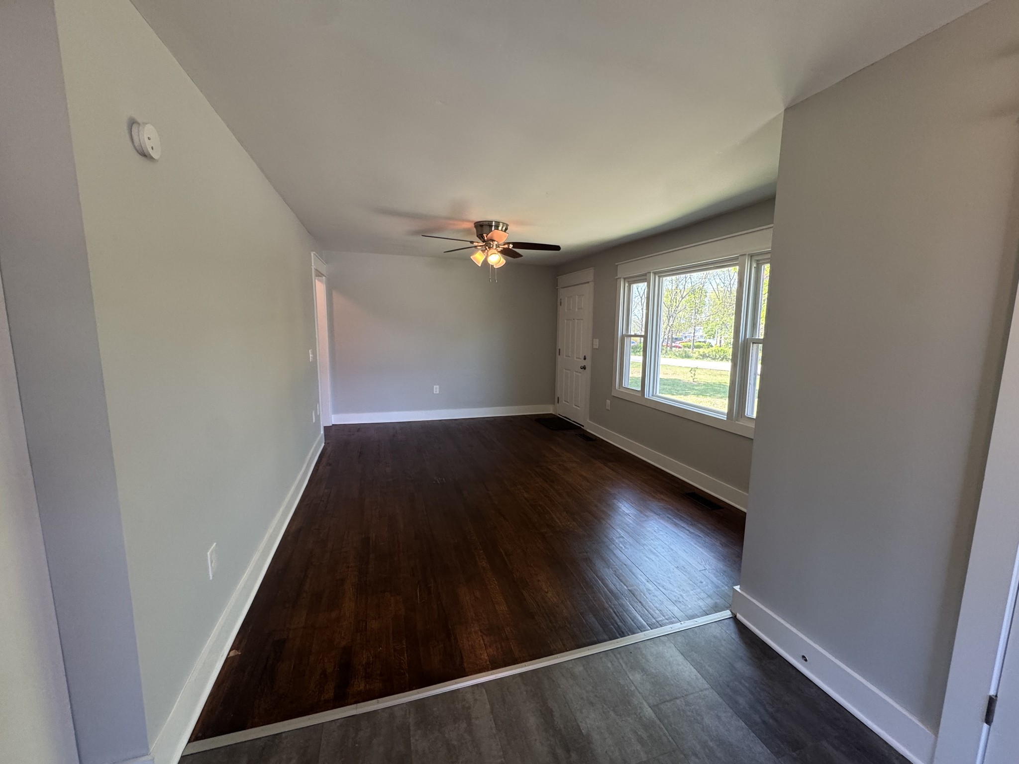 754 Cranor Road Murfreesboro, TN 37130 - Photo 13 of 21 an empty room with wooden floor cabinet and windows