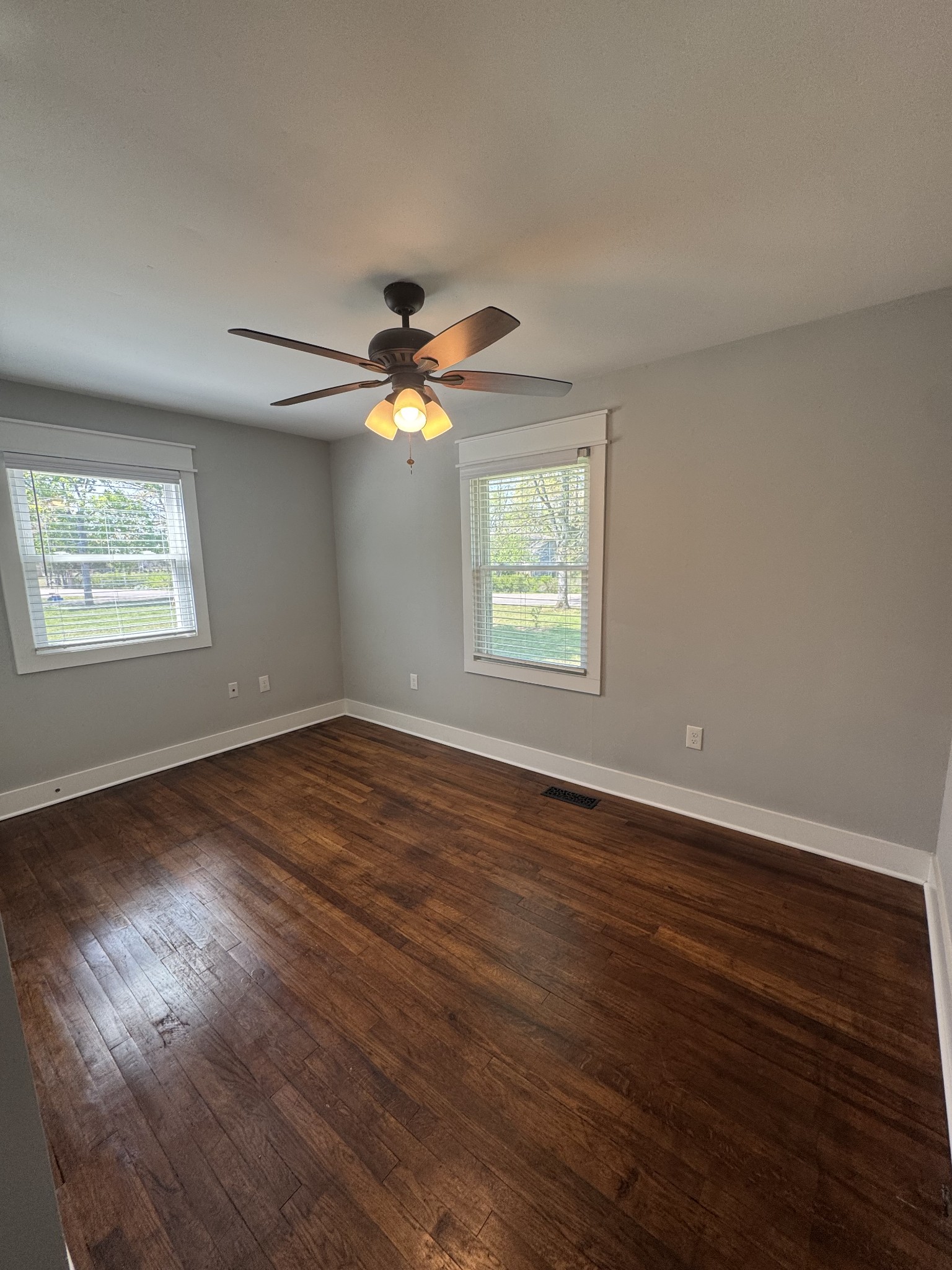 754 Cranor Road Murfreesboro, TN 37130 - Photo 18 of 21 an empty room with wooden floor chandelier fan and windows