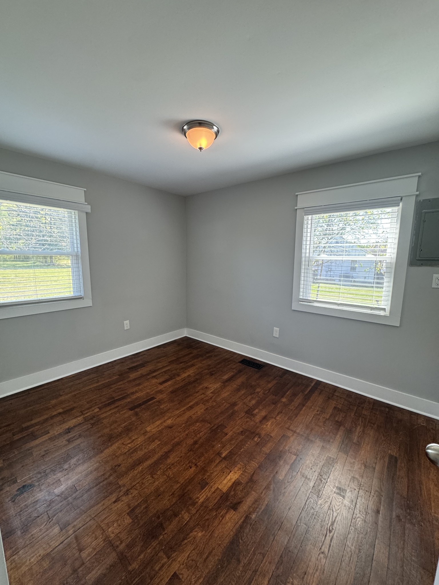 754 Cranor Road Murfreesboro, TN 37130 - Photo 20 of 21 an empty room with wooden floor and windows