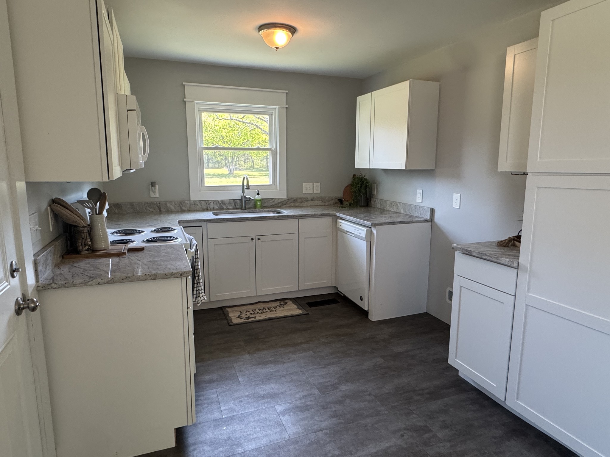 754 Cranor Road Murfreesboro, TN 37130 - Photo 6 of 21 a kitchen with stainless steel appliances granite countertop a sink stove and window