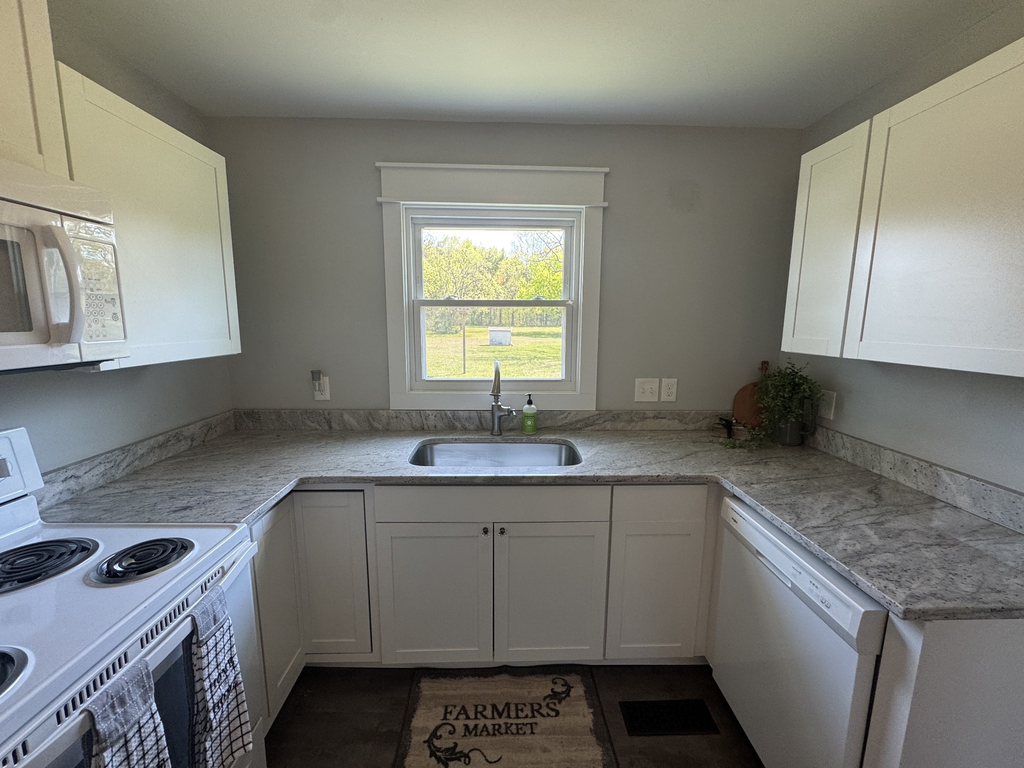 754 Cranor Road Murfreesboro, TN 37130 - Photo 9 of 21 a kitchen with a sink stove and cabinets