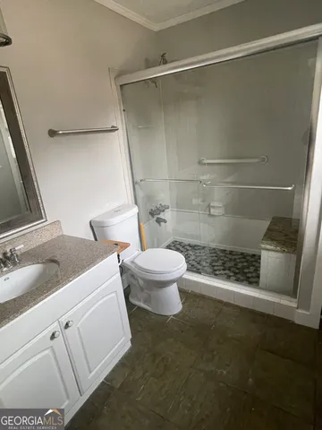a bathroom with a toilet and a sink