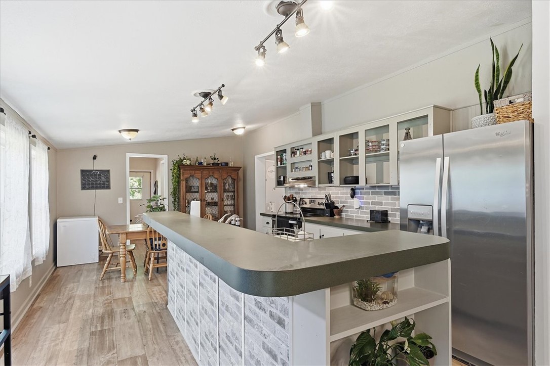 1014 Harris Road Anderson, SC 29625 - Photo 8 of 34 A contemporary kitchen space boasts sleek countertops and an inviting breakfast bar.
