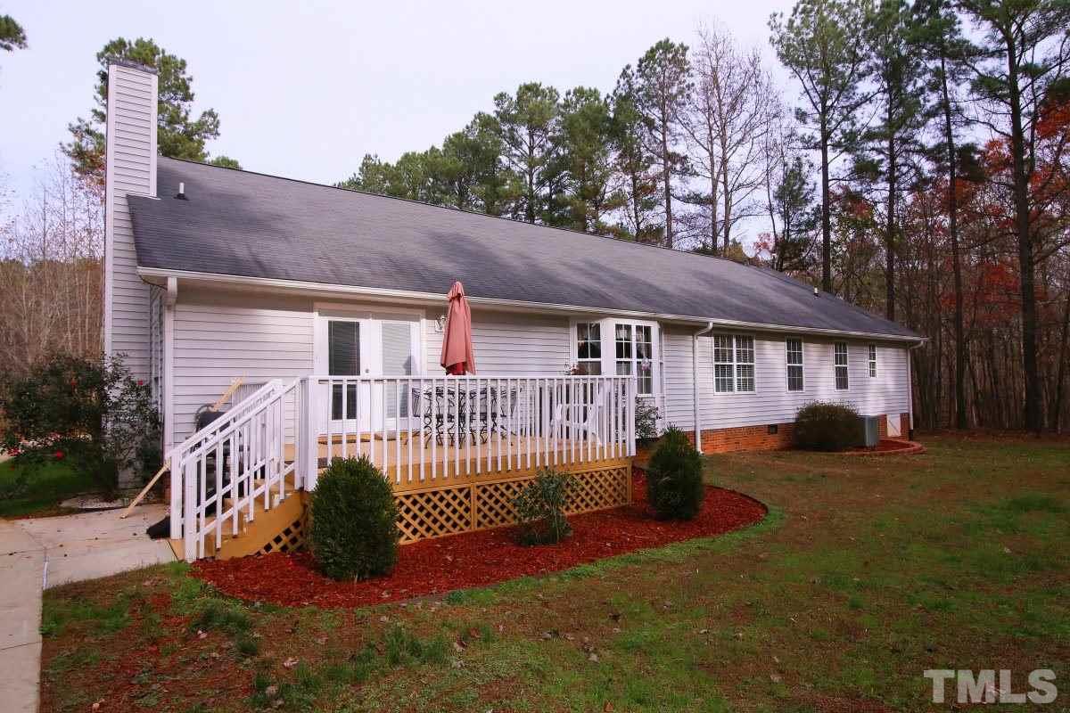 101 Moray Drive Raleigh, NC 27613 - Photo 22 of 25 a view of a house with a yard porch and sitting area